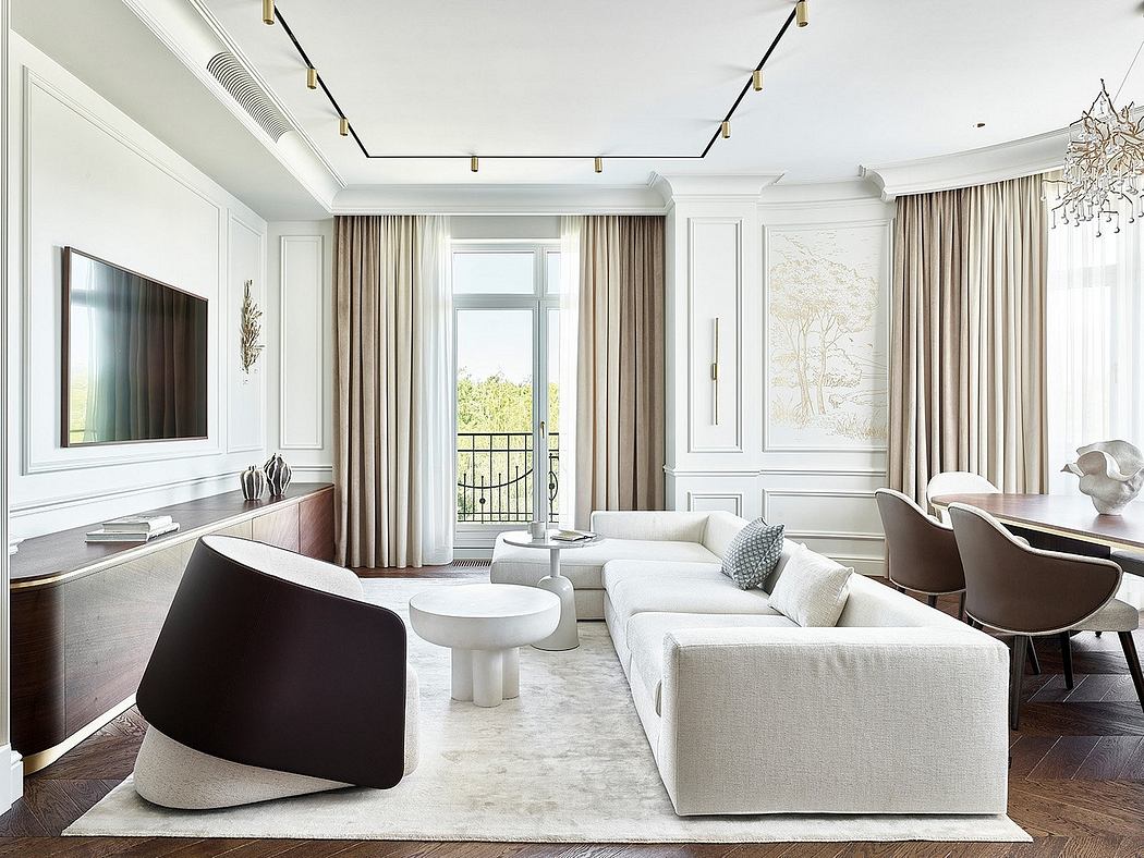 Elegant living room with recessed lighting, modern furnishings, and French doors leading to a balcony.