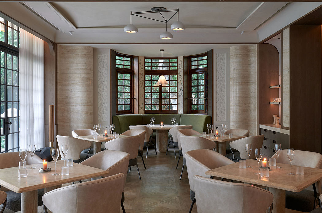 Elegant dining area with large windows, wood paneling, and cozy seating.