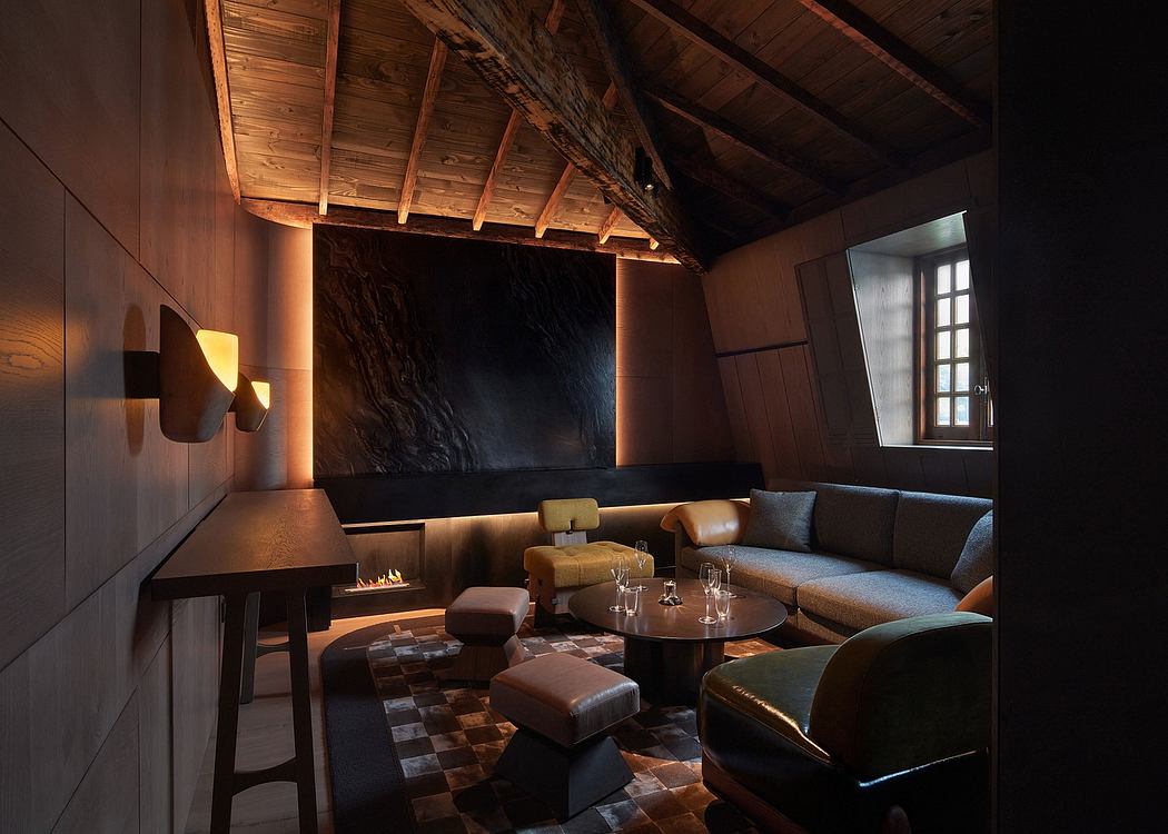 Cozy rustic lounge with wooden beams, fireplace, and plush seating arrangement.