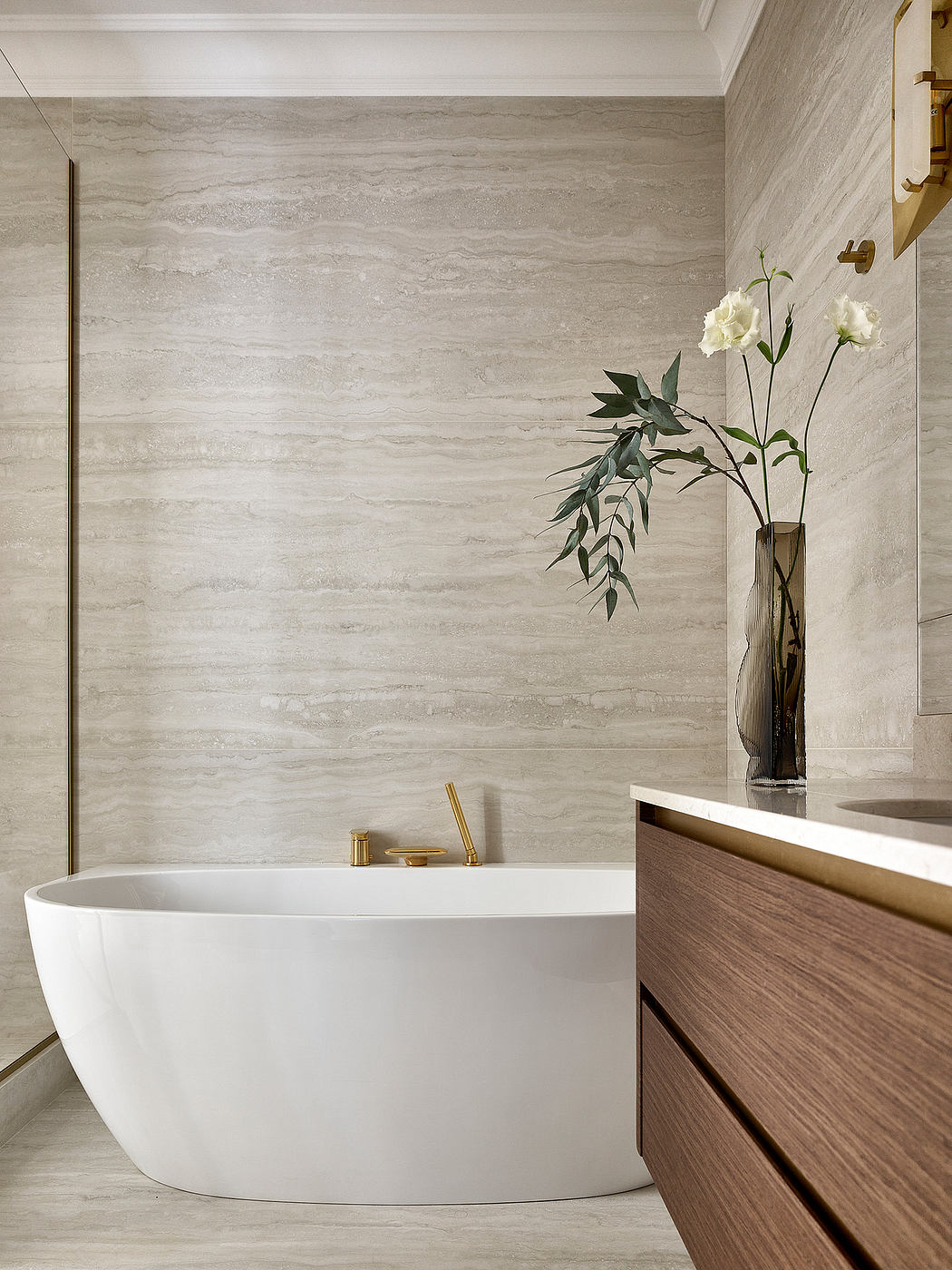 Contemporary bathroom with freestanding tub, wood vanity, and floral decor.