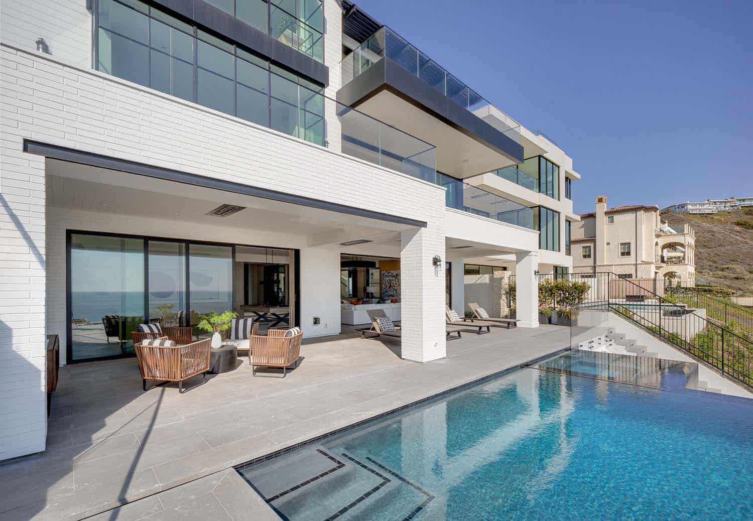 coastal contemporary patio with a swimming pool