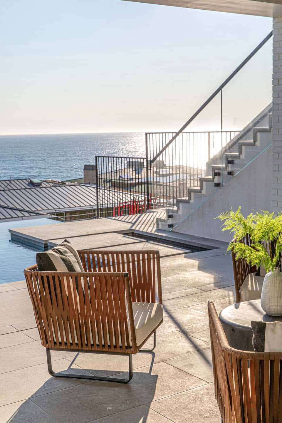 coastal contemporary patio with a swimming pool