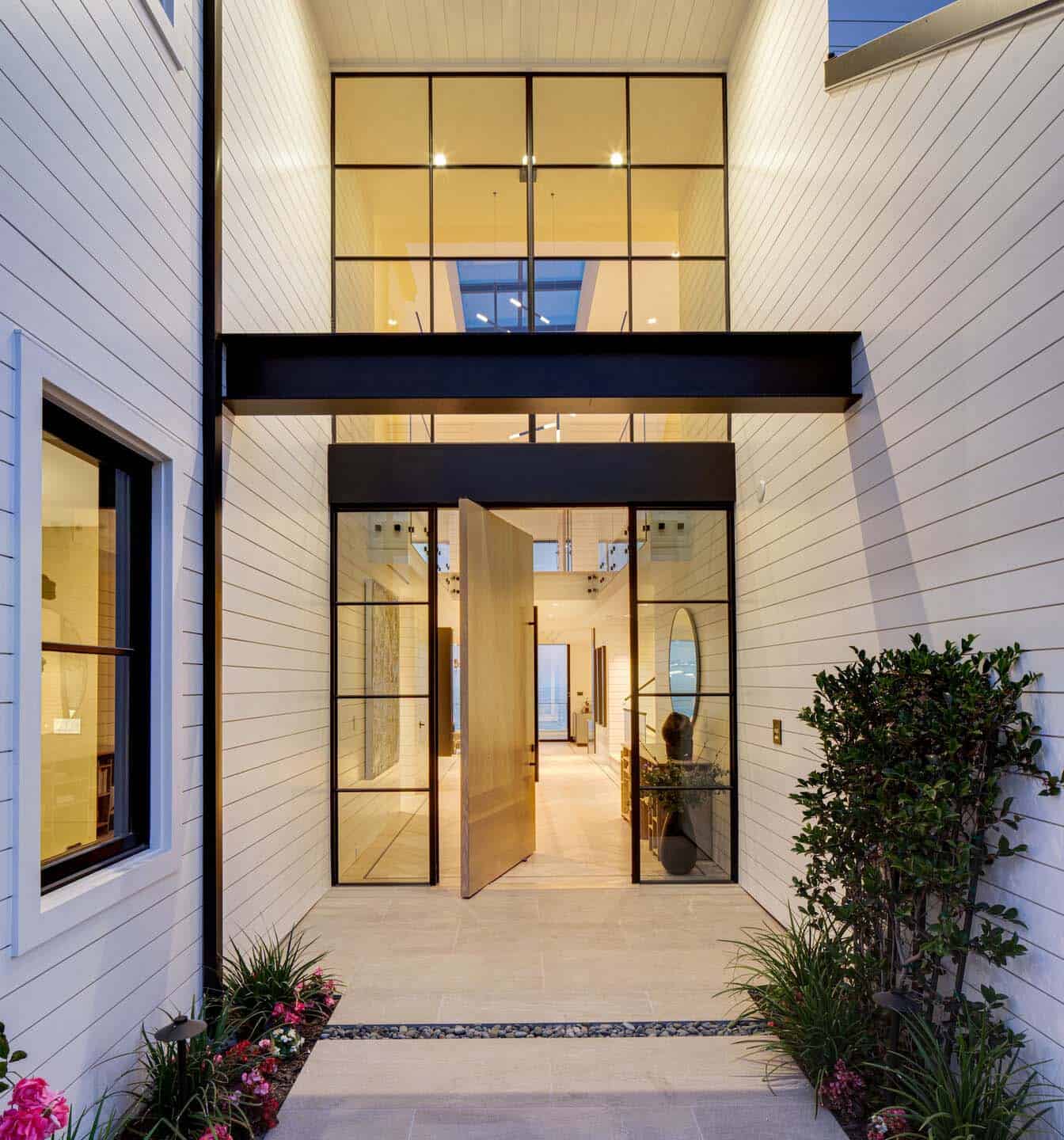 coastal contemporary home entry at dusk