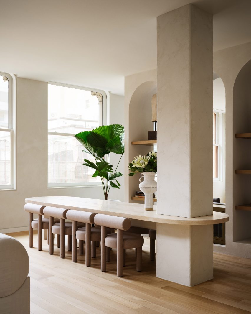 Dining table anchored to a structural column