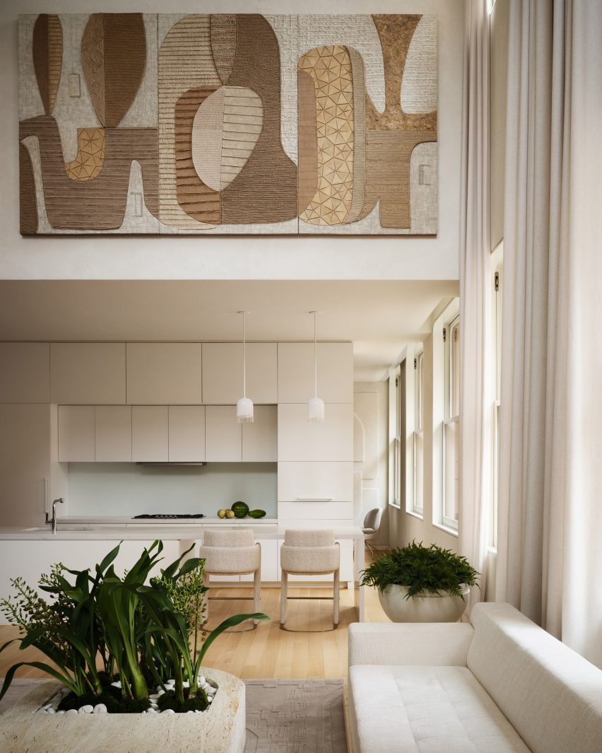 Minimalist kitchen viewed from double-height living room